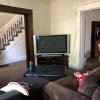 View 2 of the living room with 2nd floor stairs in background