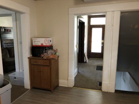 View 2 of kitchen with main house door in background
