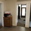 View 2 of kitchen with main house door in background