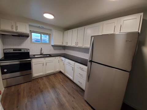 Renovated kitchen with Subway tile back splash & granite countertopsi