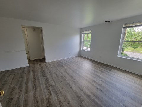 Living Room w/ new flooring & new windows