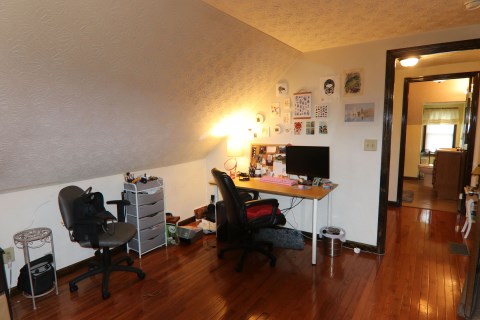 View 3 of 3rd floor bedroom with window A/C unit. 3rd floor full bathroom is also visible