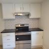 New range surrounded by new cabinets and granite counters