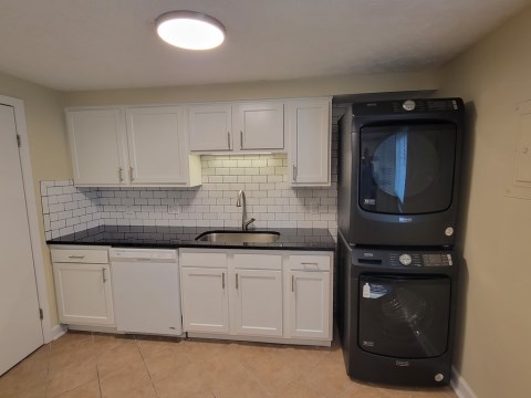 Renovated kitchen with Subway tile back splash & granite countertops