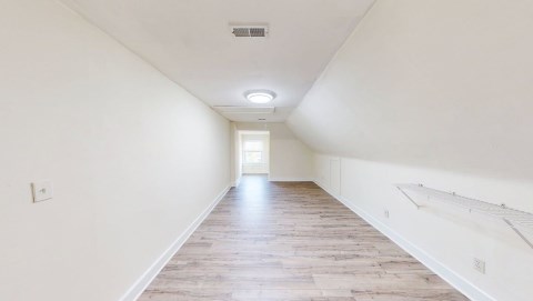 Big upstairs bedroom with new LVT flooring and lighting!