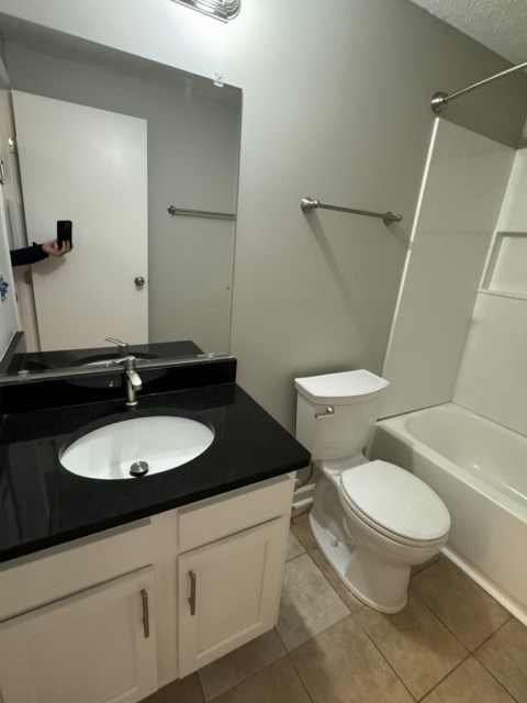 Renovated bathroom w/ granite sink and Moen fixtures