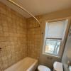 Bathroom with tile surround and pedestal sink