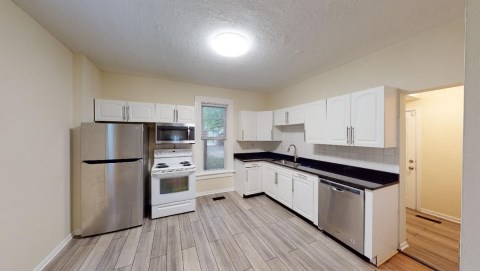 Beautiful kitchen with newer granite countertops, flooring and stainless steel appliances!