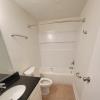 Renovated bathroom w/ new bathtub, surround and vanity with granite countertops