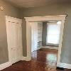 Dining Room with Half Bath to Left and looking into Living Room