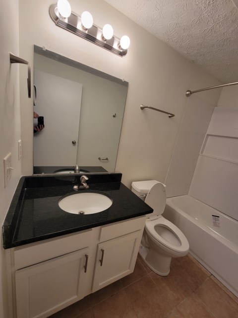 New vanity w/ granite tops and Kohler faucet