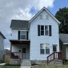 Front of home w/ new concrete sidewalks and porch
