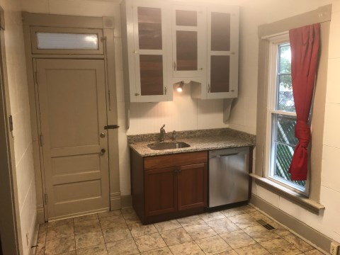 Kitchen with granite and Large stainless fridge