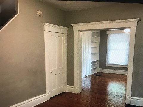Dining Room with Half Bath to Left and looking into Living Room