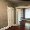 Dining Room with Half Bath to Left and looking into Living Room