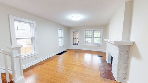 Beautiful fireplace and hardwood floors in the living room