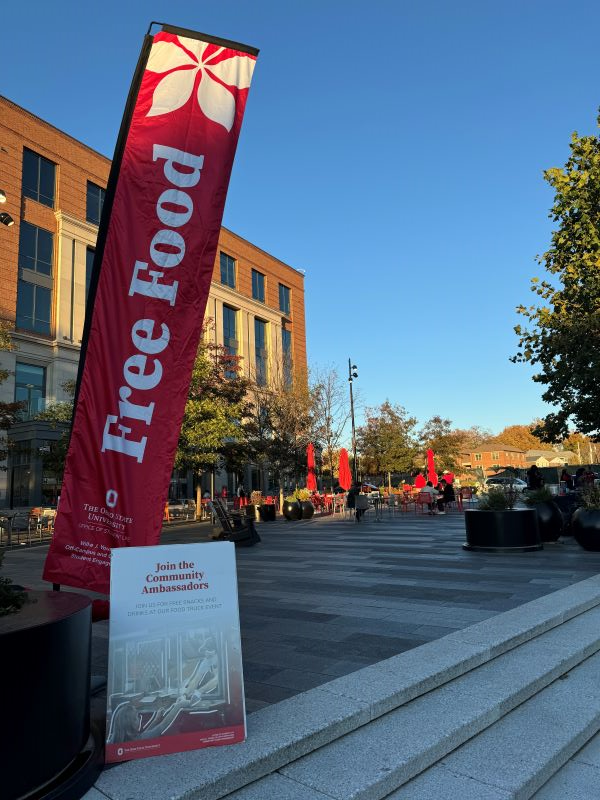 Large flag that reads "free food" at University Square during a BLOC (Buckeyes Living Off-Campus) Party
