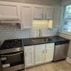 Renovated kitchen with Subway tile back splash & granite countertops