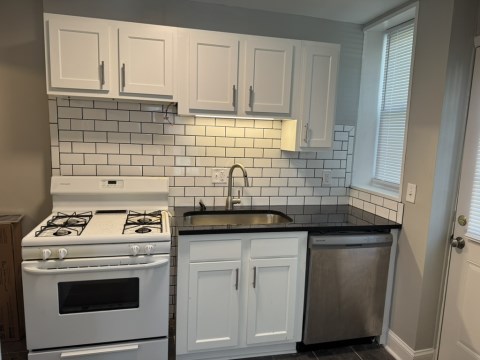 Renovated kitchen with Subway tile back splash & granite countertopsit
