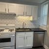 Renovated kitchen with Subway tile back splash & granite countertopsit