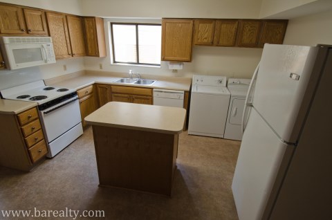 Kitchen with island, washer and dryer included
