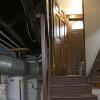 Going up from the basement with view of water heater