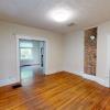Dining Room with Gorgeous Lighting and Hardwood Floors!