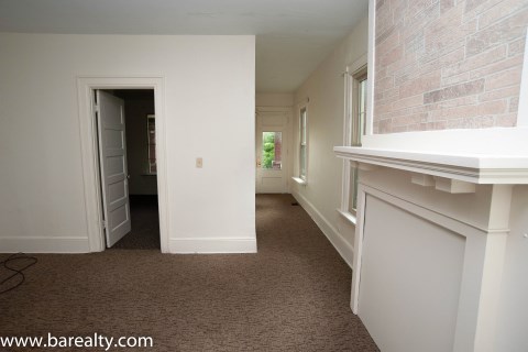 View from family room to front door; bedroom on first floor