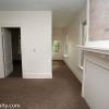 View from family room to front door; bedroom on first floor