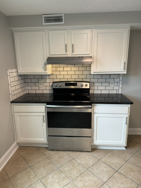 Renovated kitchen with Subway tile back splash & granite countertopsit