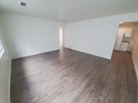 Living Room w/ new flooring & new windows