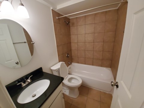 Renovated bathroom w/ new bathtub, surround and vanity with granite countertopsoo