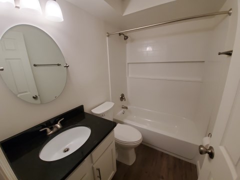 Renovated bathroom w/ new bathtub, surround and vanity with granite countertopsoo