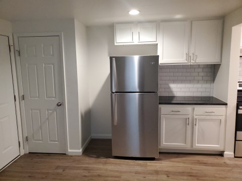 Kitchen extension with refrigerator and coat closet