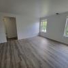 Living Room w/ new flooring & new windows