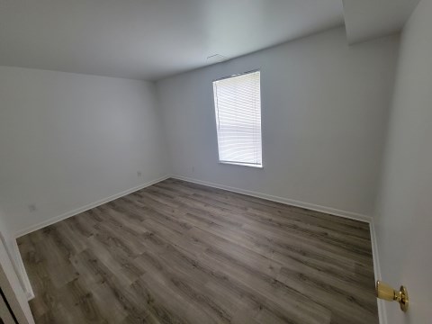 Bedroom w/ new flooring