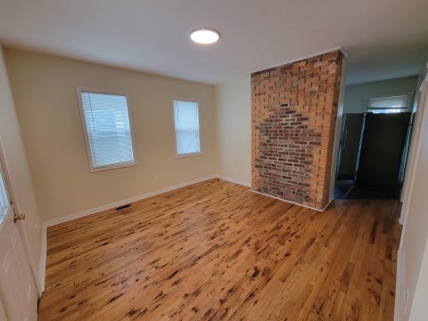 Living Room w/ new wood flooring & new windows