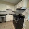 Renovated kitchen w/ granite countertops subway tile back splash and stainless appliances