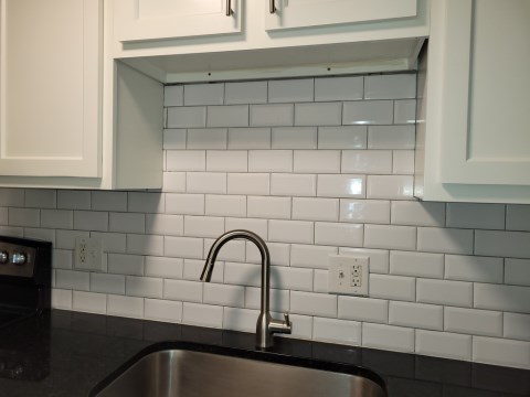 Renovated kitchen with Subway tile back splash & granite countertopsh
