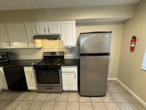 Renovated kitchen with Subway tile back splash & granite countertops