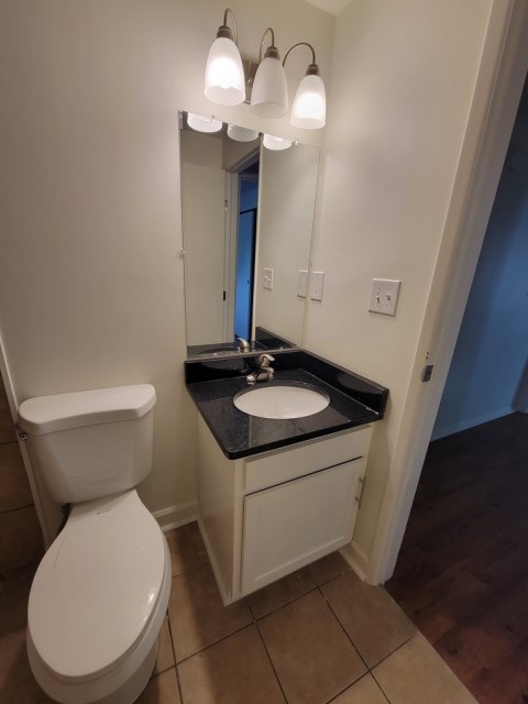 Renovated bathroom w/ new bathtub, surround and vanity with granite countertops