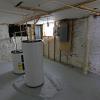 30-Basement Room 3 With Water Heaters and Fuse Boxes