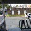 View of parking lot and garages from kitchen rear door