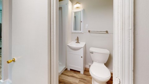 This full bathroom is brand new!  New toilet, new shower, new flooring, new lighting, new sink and medicine cabinet!