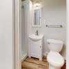 This full bathroom is brand new!  New toilet, new shower, new flooring, new lighting, new sink and medicine cabinet!