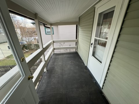 Private porch w/ view of backyard