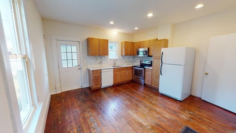 Big spacious kitchen with newer granite countertops / granite back splash!