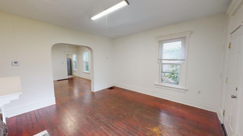 Living room with view of dining room