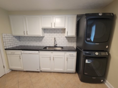 Renovated kitchen with Subway tile back splash & granite countertops