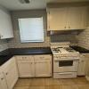 Renovated kitchen with Subway tile back splash & granite countertops